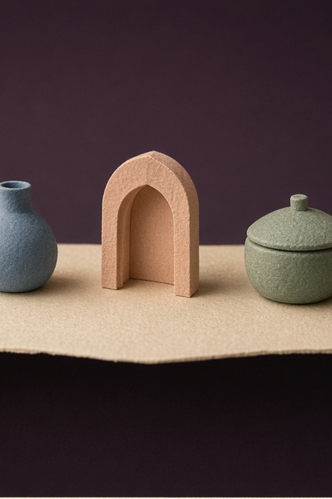 Three unlabeled paper objects arranged with calm space between them